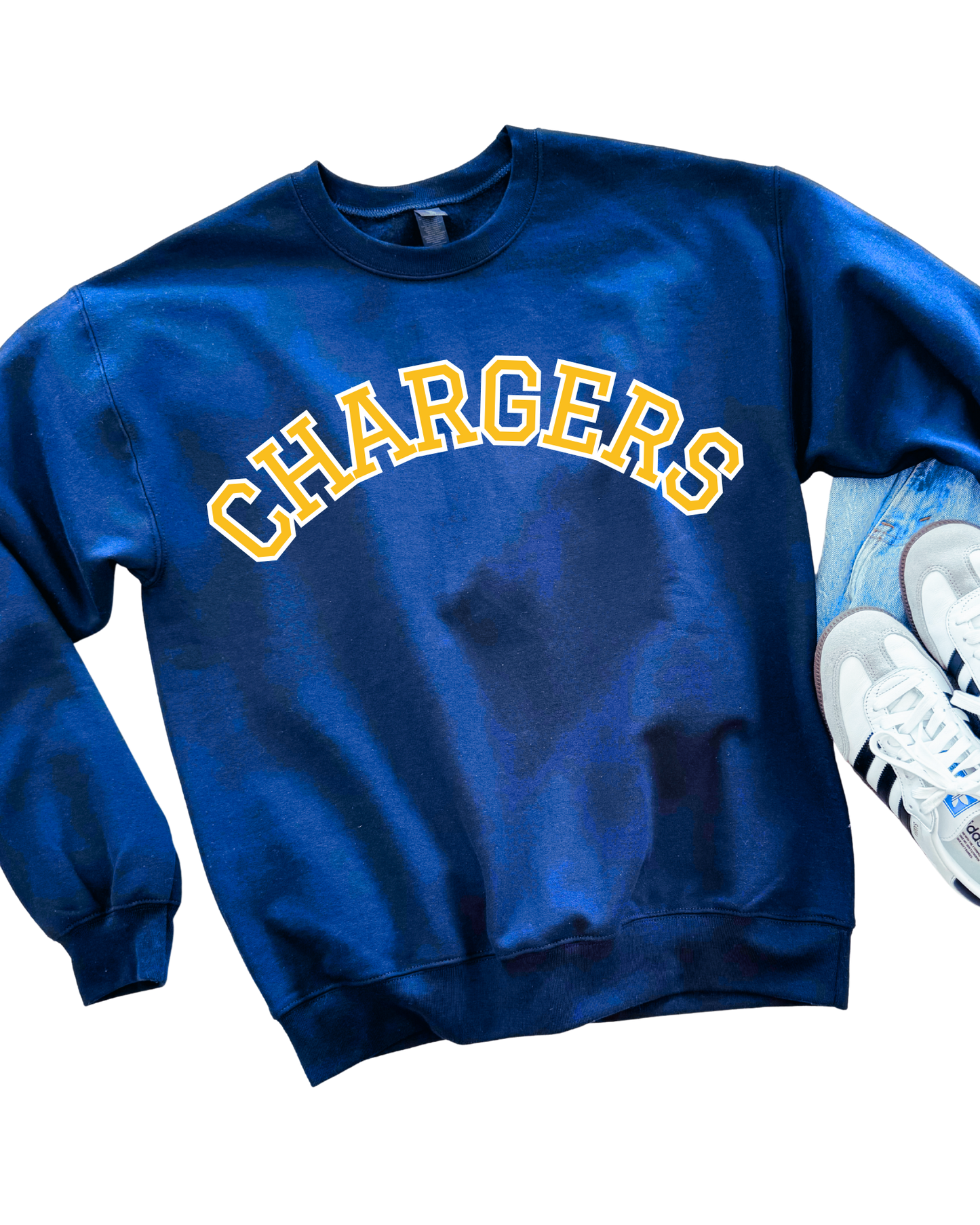 Blue sweatshirt with 'CHARGERS' text and white sneakers on a white background