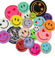 May include: A collection of colorful embroidered and sequined smiley face patches. The patches are various sizes and shapes, with some featuring hearts, stars, and lightning bolts. Some patches are fuzzy, while others are made of sequins. The patches are arranged in a random pattern on a white background.