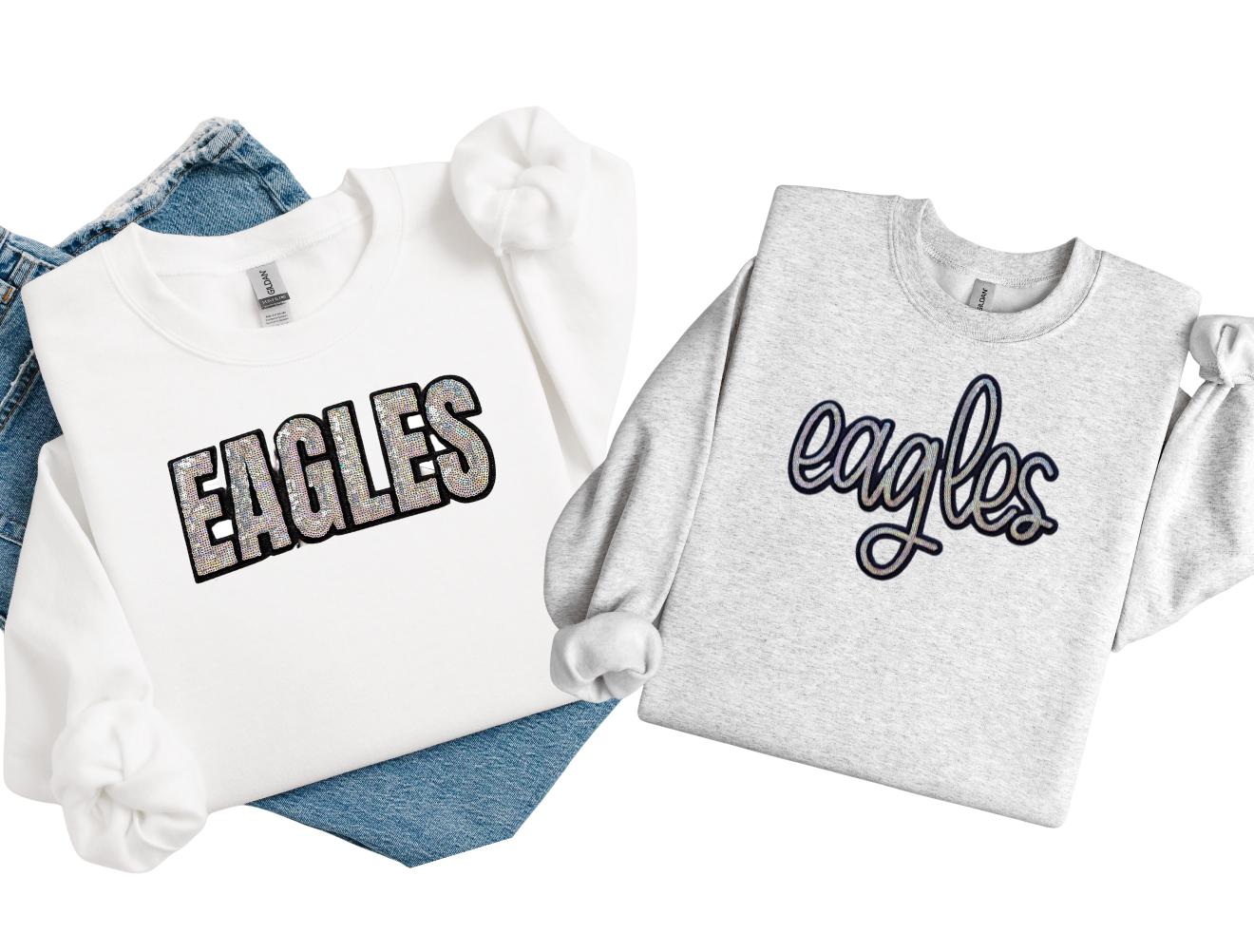 Two sweatshirts with 'EAGLES' text on a white background