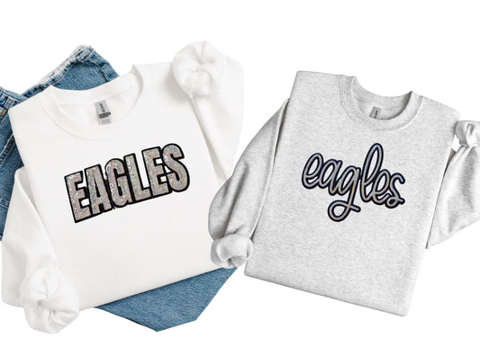 Two sweatshirts with 'EAGLES' text on a white background